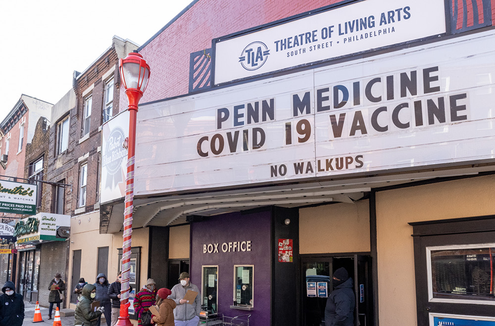 The Theatre of the Living Arts marquee advertises the Pennsylvania Hospital COVID-19 vaccine clinic.